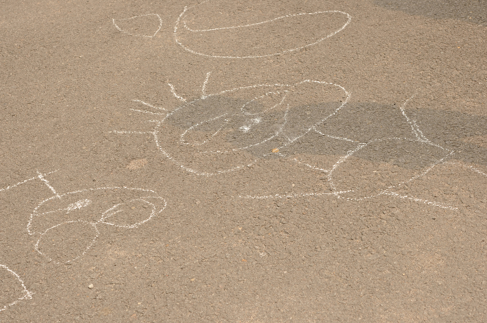 Child's sidewalk chalk drawing of a person