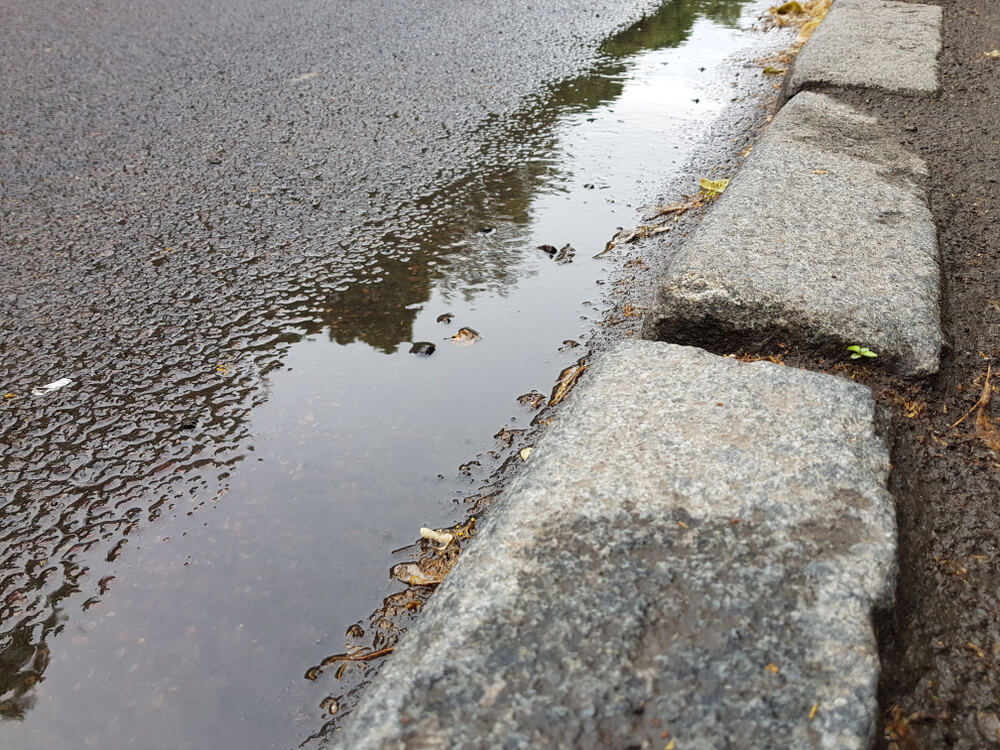 how to deal with standing water on driveways