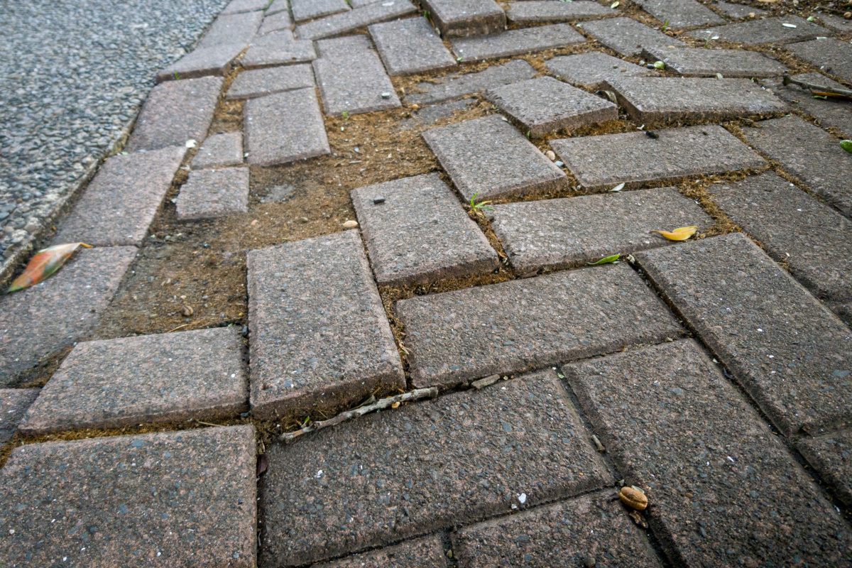 DIY vs. Hiring Pros to Raise Concrete Sidewalk Slab: Costs and Risks